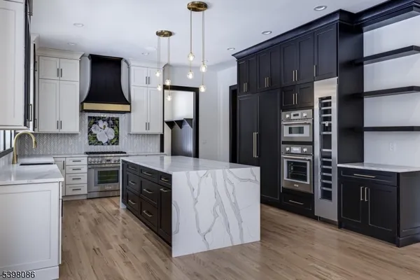 a kitchen with cabinets and stainless steel appliances