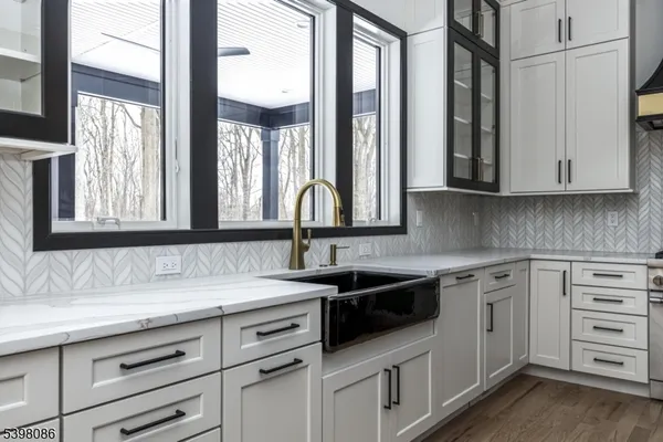 a kitchen with appliances cabinets and a sink