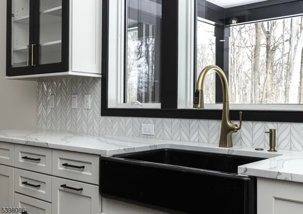 a kitchen with a sink and a window