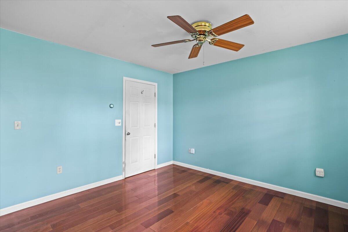 292 Clearview Road Long Pond, PA 18334 - Photo 15 of 33 an empty room with wooden floor a ceiling fan and windows