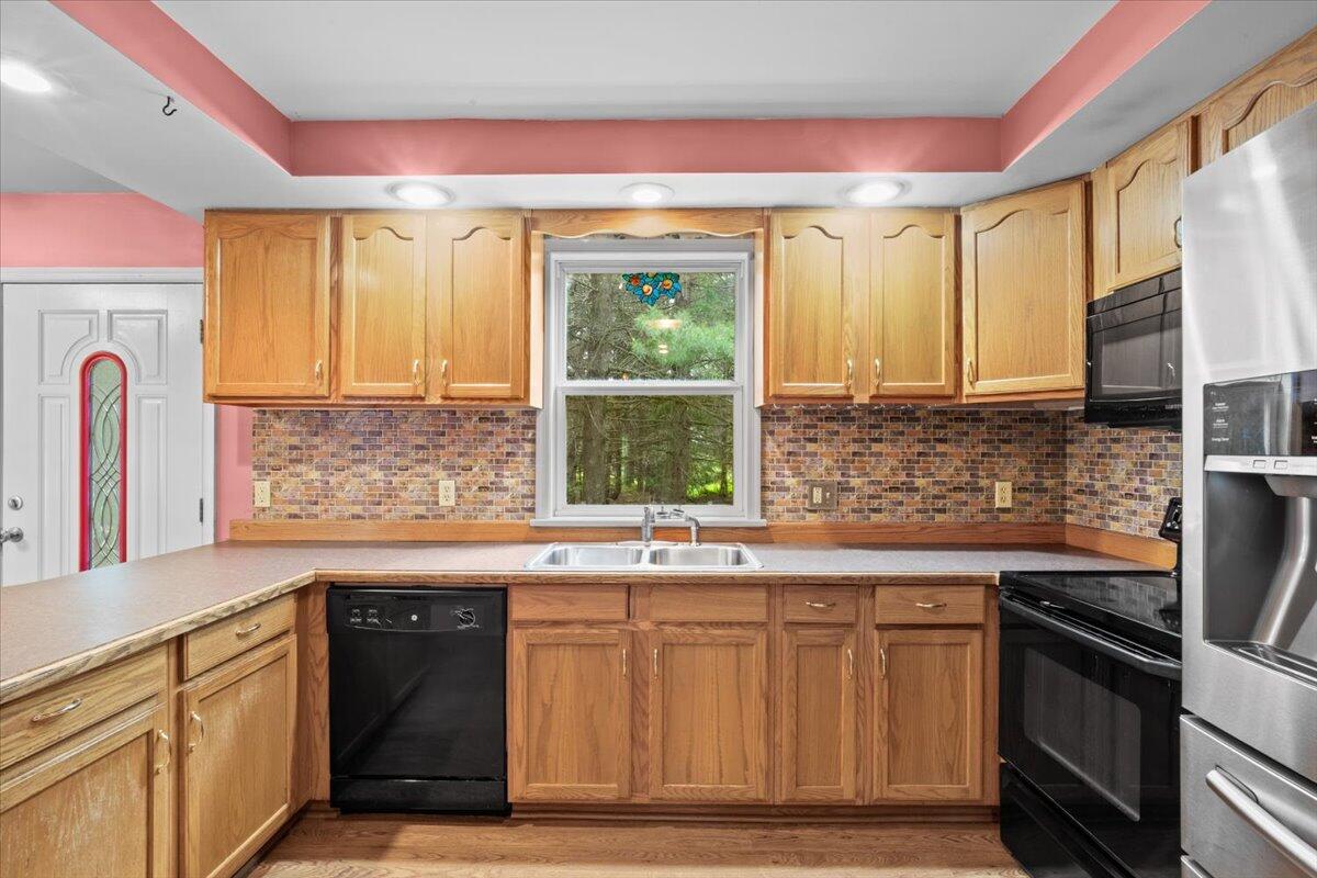 292 Clearview Road Long Pond, PA 18334 - Photo 8 of 33 a kitchen with stainless steel appliances granite countertop a sink a stove and a refrigerator