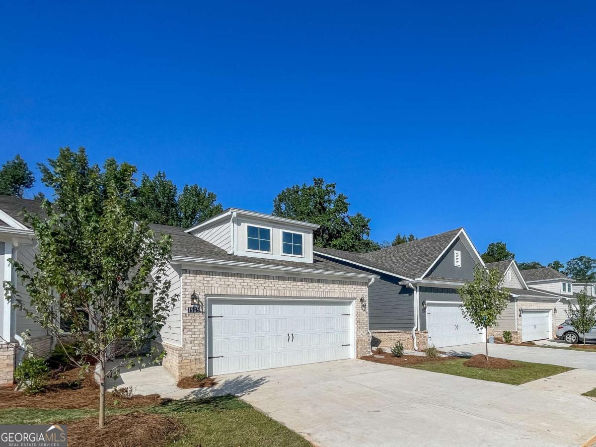 1545 Salinger Court, Unit 1545 Stockbridge, GA 30281 - Photo 1 of 26 a front view of a house with a yard