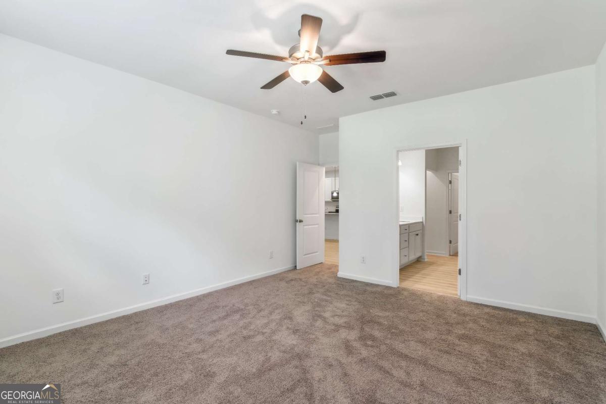 1545 Salinger Court, Unit 1545 Stockbridge, GA 30281 - Photo 14 of 26 a view of an empty room