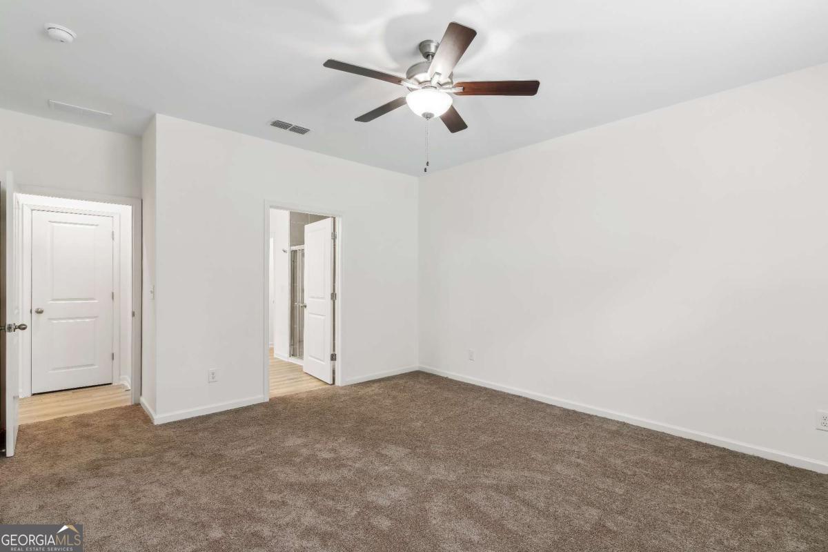 1545 Salinger Court, Unit 1545 Stockbridge, GA 30281 - Photo 15 of 26 a view of an empty room