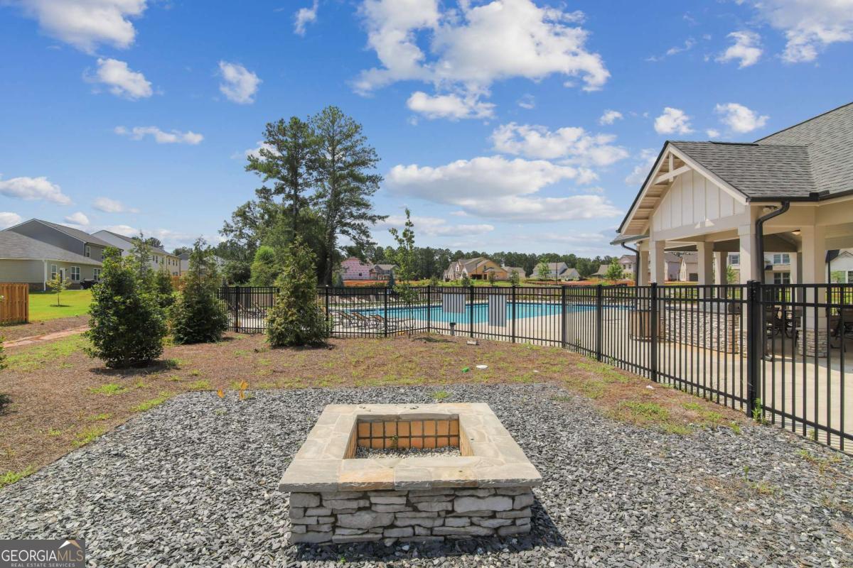 1545 Salinger Court, Unit 1545 Stockbridge, GA 30281 - Photo 22 of 26 a view of a backyard with sitting area