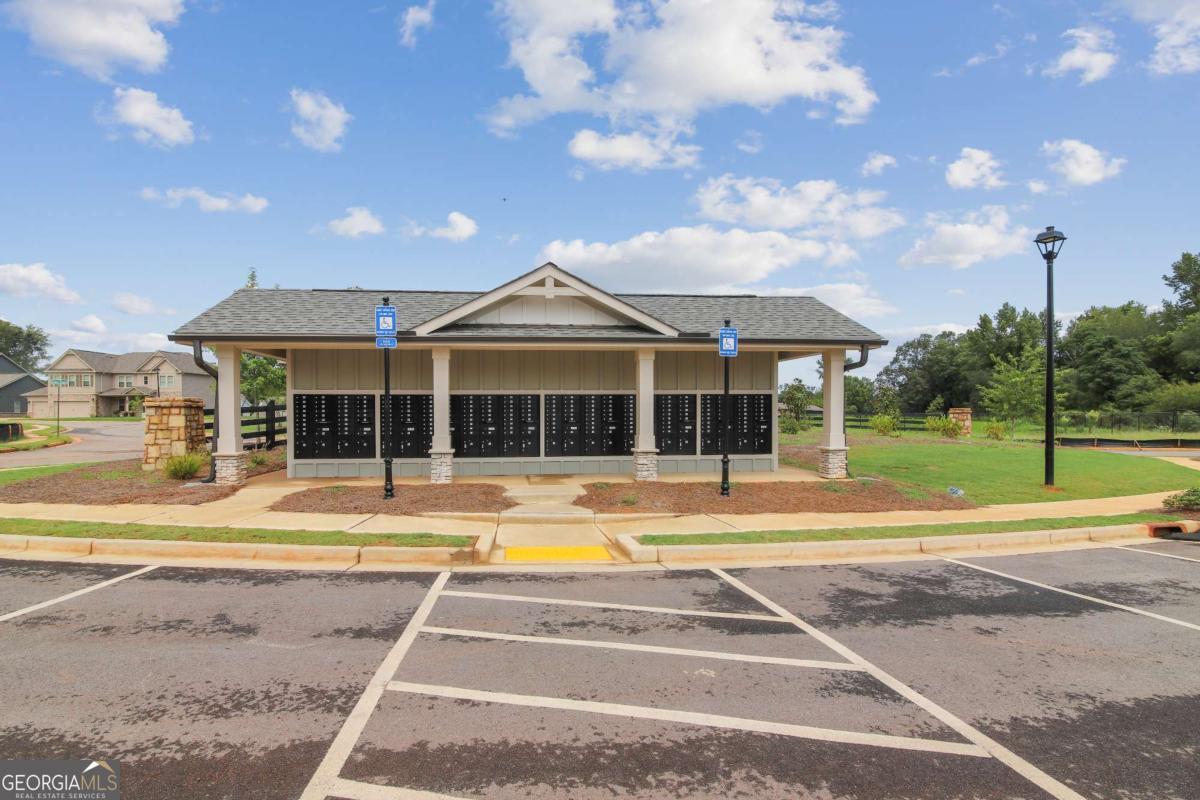1545 Salinger Court, Unit 1545 Stockbridge, GA 30281 - Photo 23 of 26 a view of a house with a swimming pool and a yard