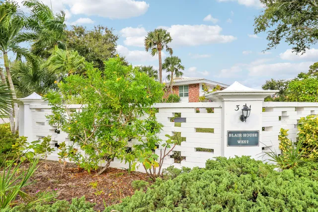 front view of a house with a garden