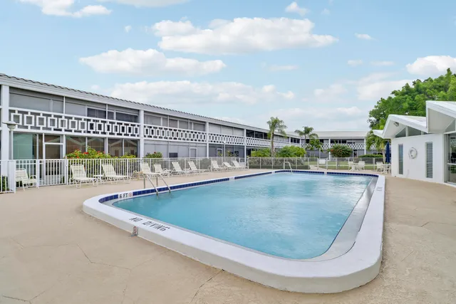 a view of a swimming pool with a patio