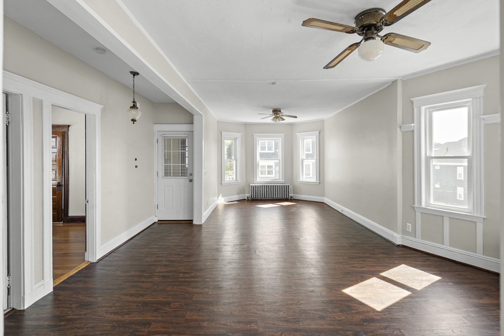 22 Gardena Street, Unit 3 Boston, MA 02135 - Photo 12 of 30 a view of empty room with wooden floor and fan