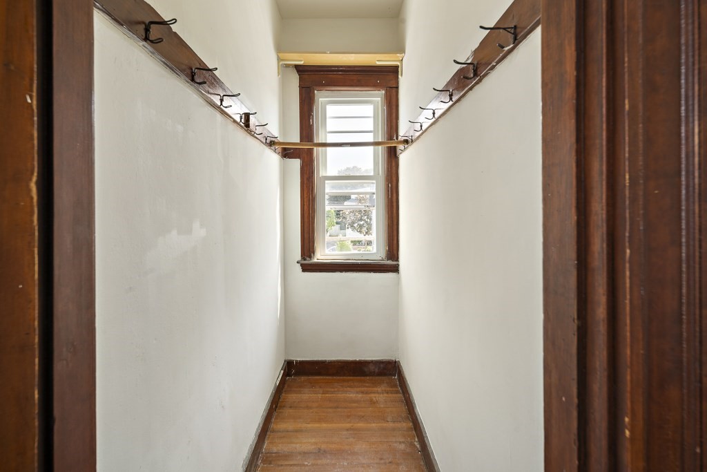 22 Gardena Street, Unit 3 Boston, MA 02135 - Photo 14 of 30 a view of a hallway with wooden floor and stairs