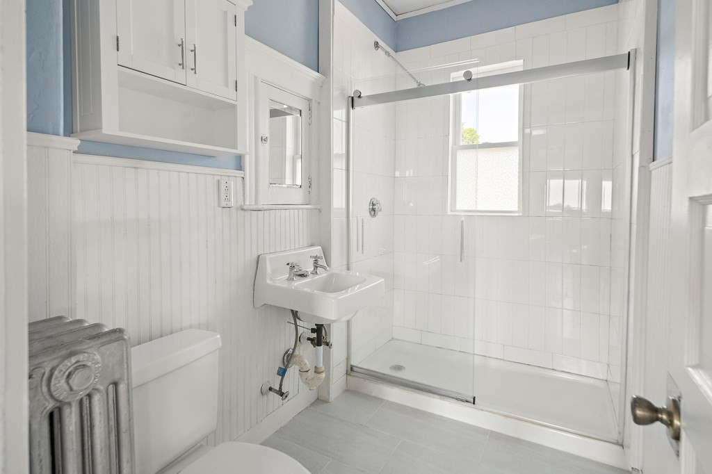 22 Gardena Street, Unit 3 Boston, MA 02135 - Photo 15 of 30 a bathroom with a sink a toilet and shower