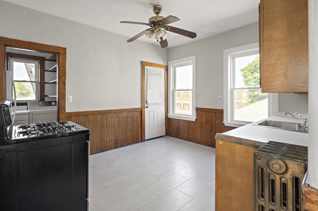 22 Gardena Street, Unit 3 Boston, MA 02135 - Photo 18 of 30 a kitchen with a sink a stove and a window