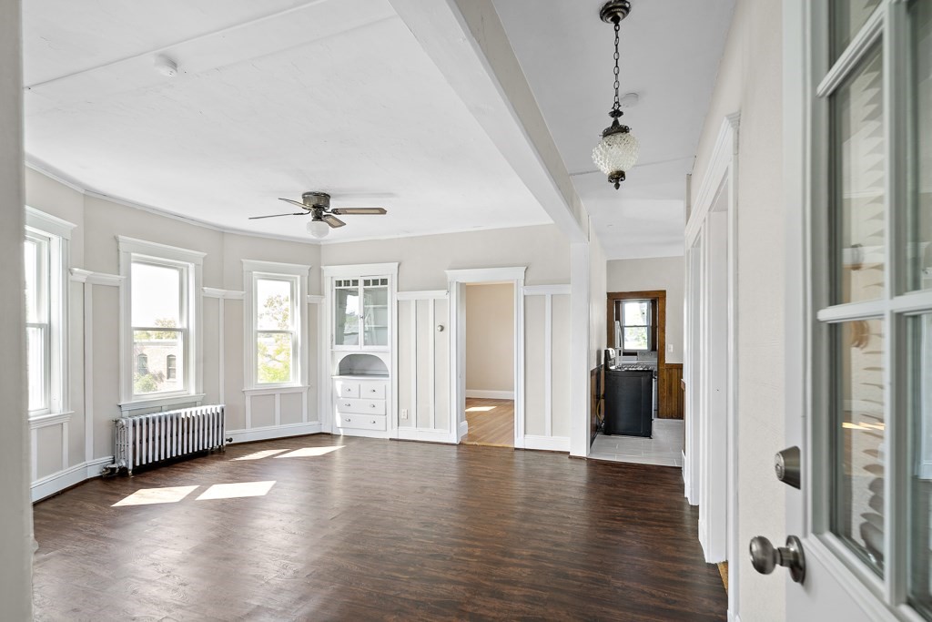 22 Gardena Street, Unit 3 Boston, MA 02135 - Photo 3 of 30 a view of an empty room with wooden floor and a window