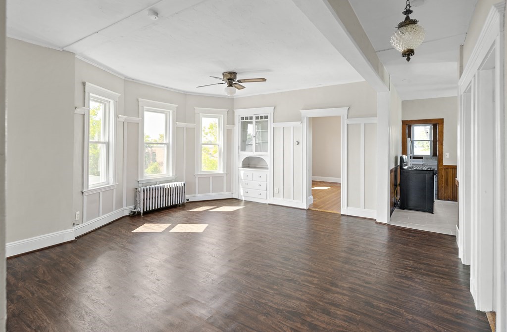 22 Gardena Street, Unit 3 Boston, MA 02135 - Photo 4 of 30 an empty room with wooden floor and windows