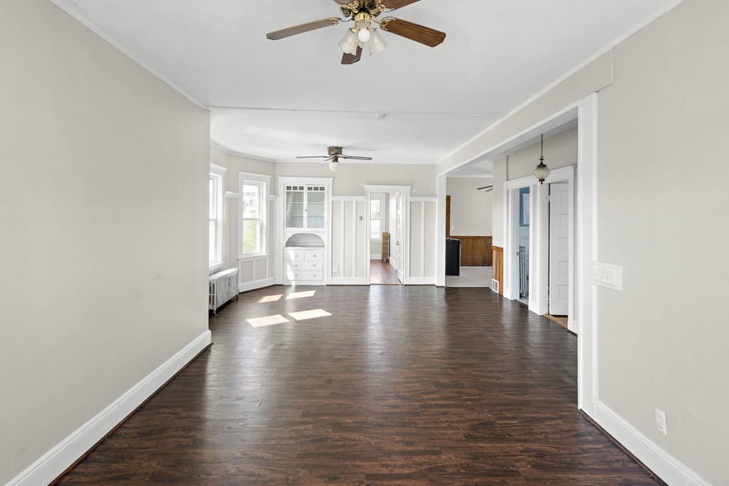22 Gardena Street, Unit 3 Boston, MA 02135 - Photo 7 of 30 a view of an empty room with wooden floor and a window