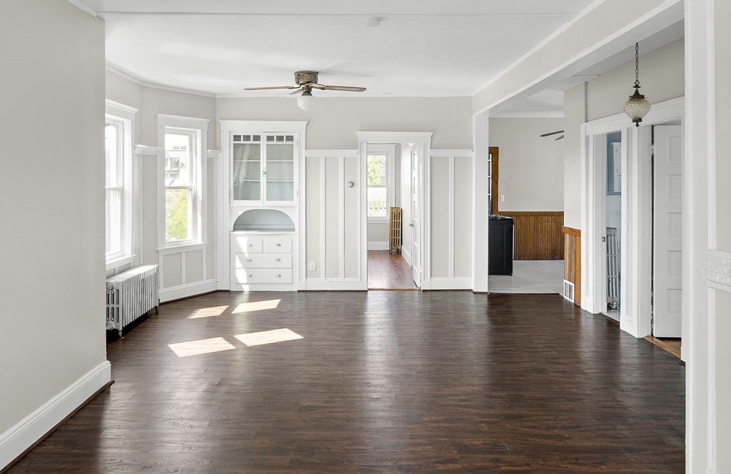 22 Gardena Street, Unit 3 Boston, MA 02135 - Photo 8 of 30 a view of an empty room with wooden floor and a window