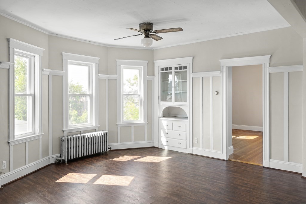 22 Gardena Street, Unit 3 Boston, MA 02135 - Photo 10 of 30 a view of an empty room with a window and wooden floor