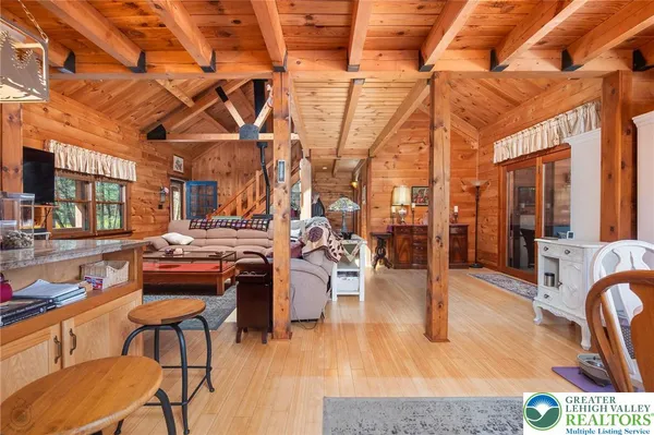 a living room with lots of furniture and a chandelier