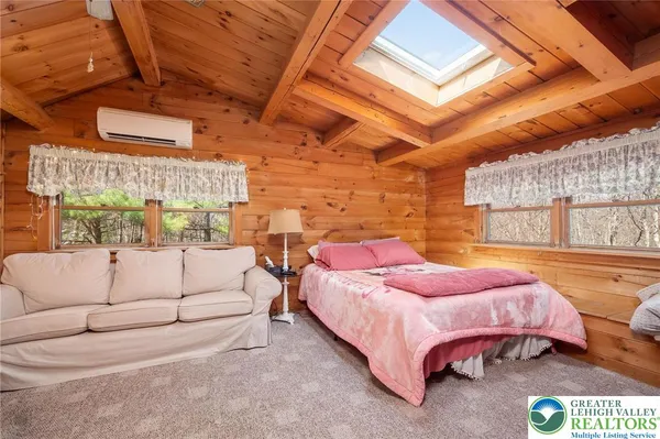 a bed room with a bed and a couch