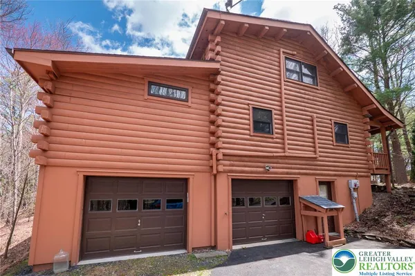 a front view of a house with garage