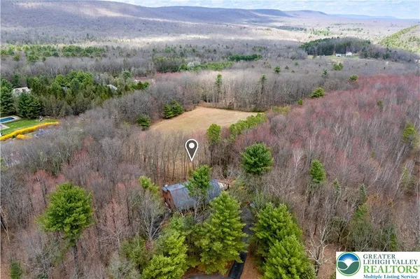an aerial view of a house with a garden