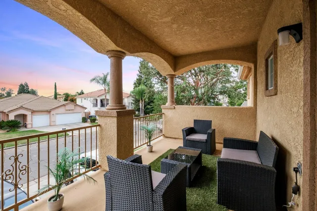 a view of balcony with furniture