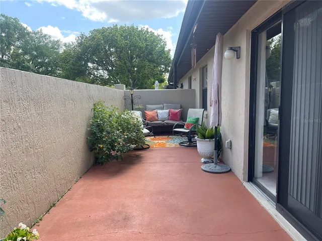 a view of a path along with potted plants