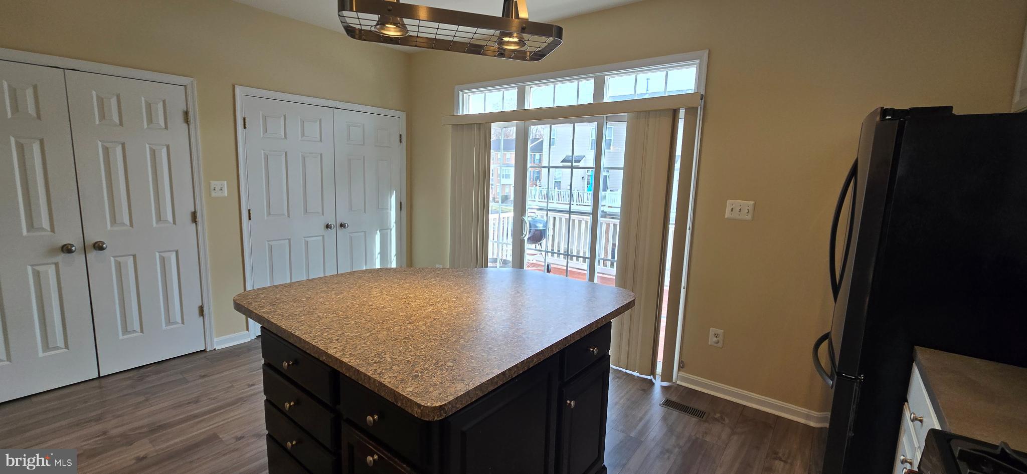 2630 Raptor Drive Odenton, MD 21113 - Photo 13 of 38 a room with a table chairs and refrigerator