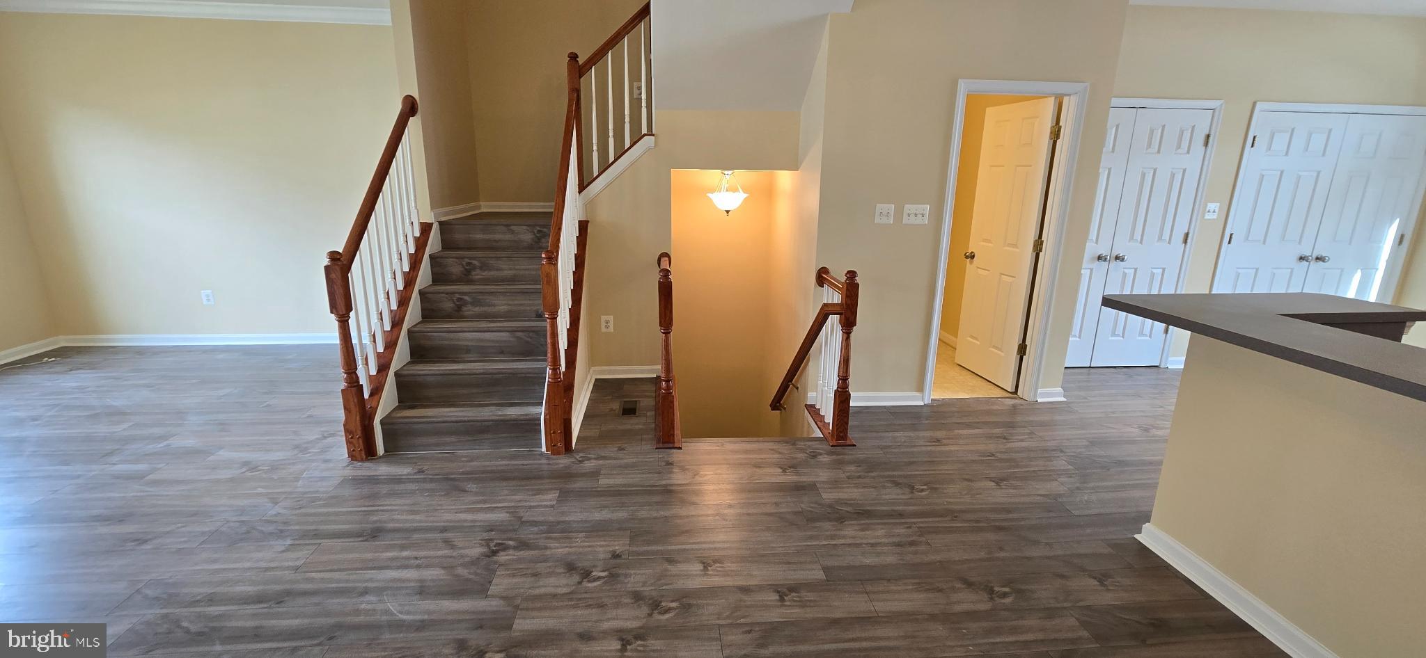 2630 Raptor Drive Odenton, MD 21113 - Photo 14 of 38 a view of a livingroom with wooden floor and stairs