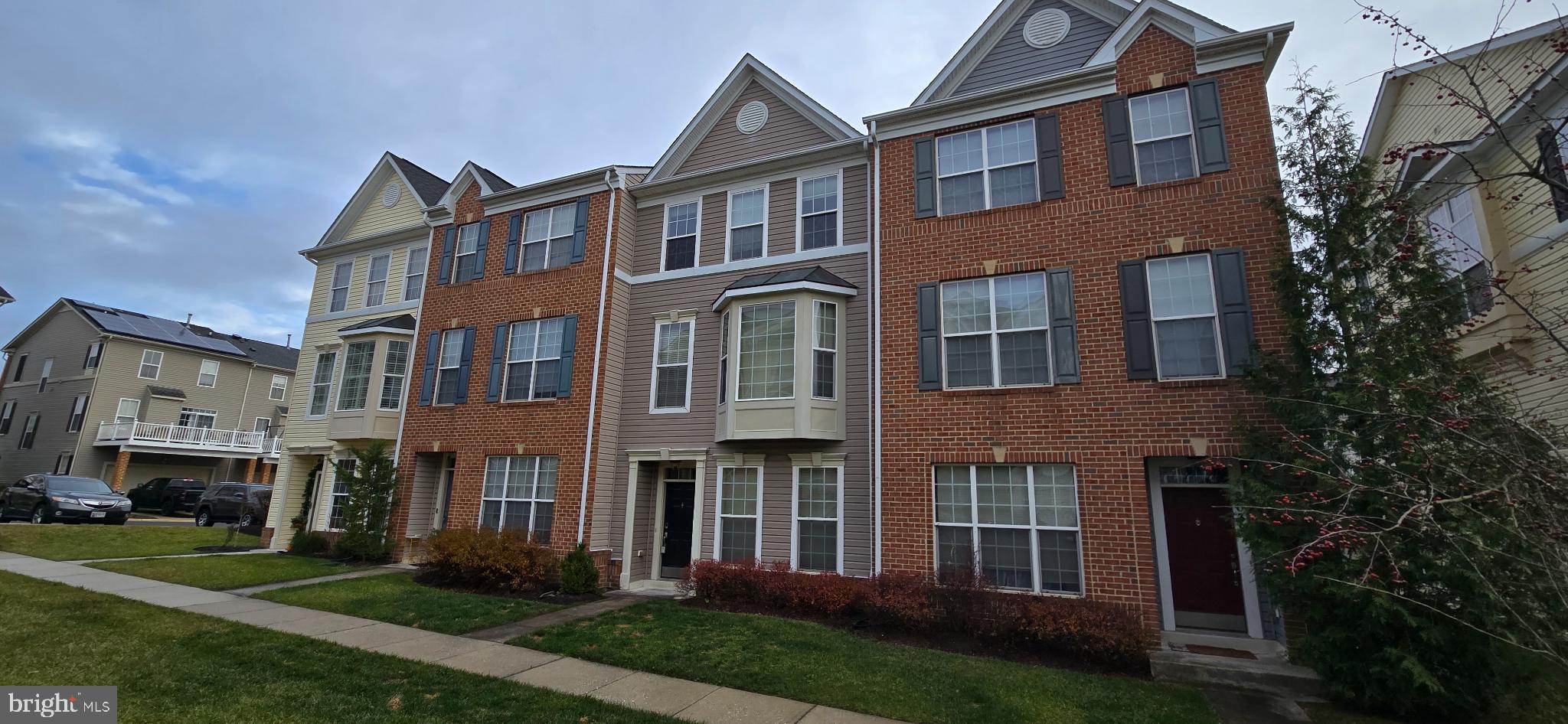 2630 Raptor Drive Odenton, MD 21113 - Photo 2 of 38 a view of a brick building next to a yard