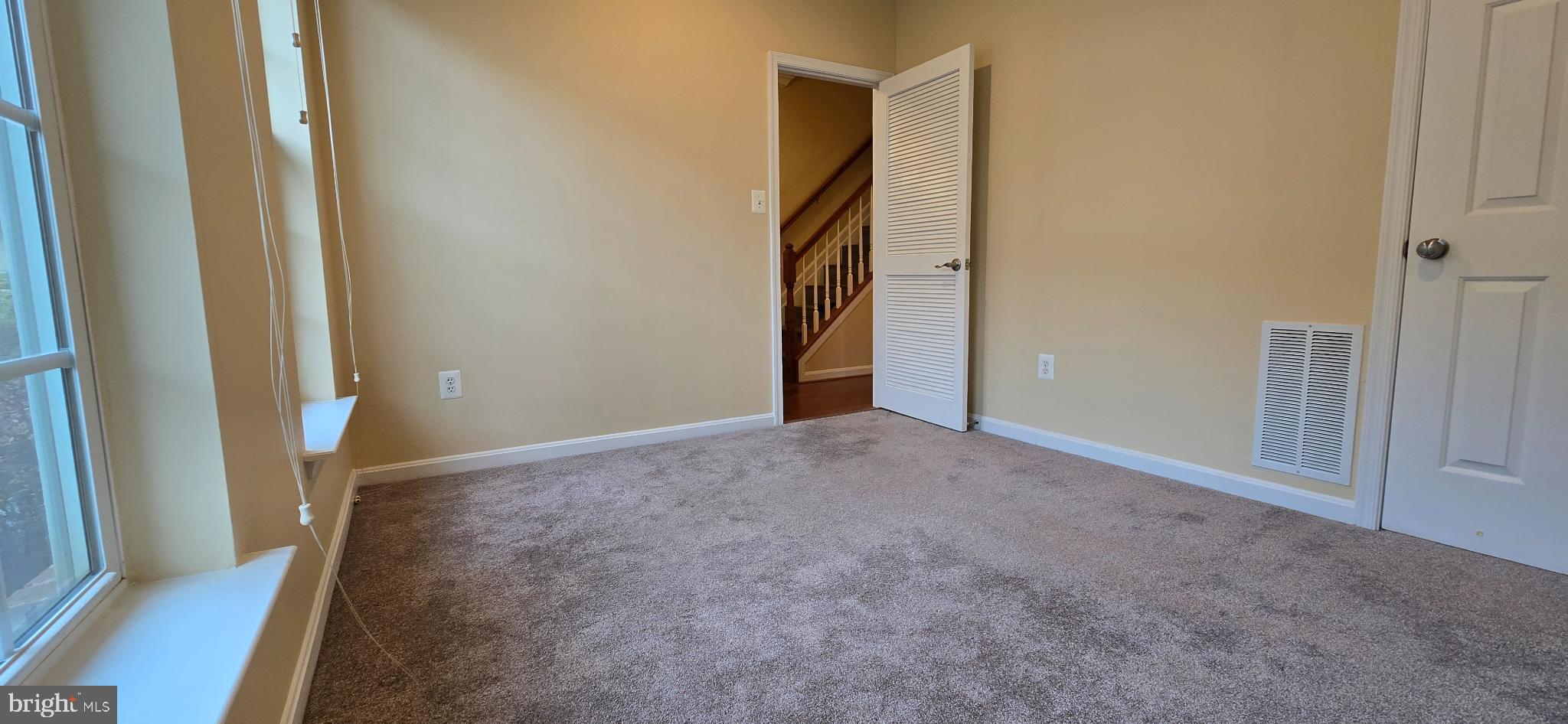 2630 Raptor Drive Odenton, MD 21113 - Photo 31 of 38 a view of hallway with stairs and wooden floor