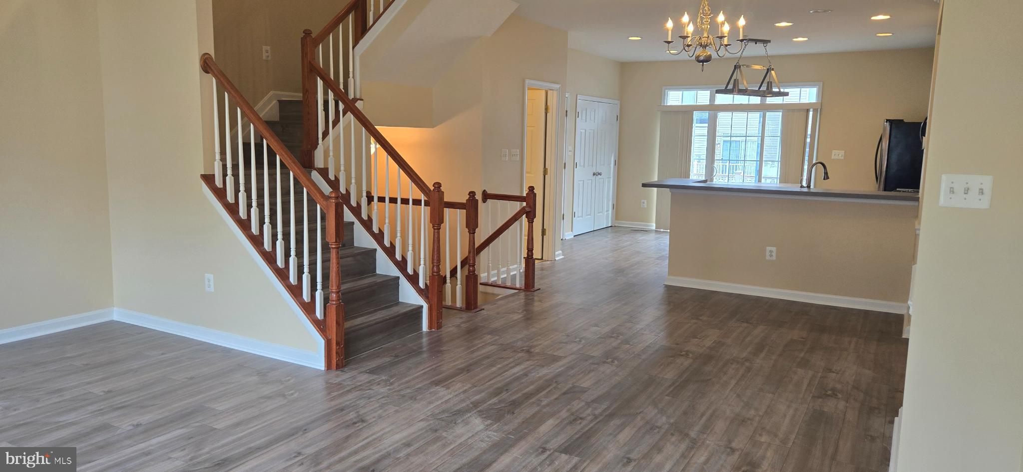2630 Raptor Drive Odenton, MD 21113 - Photo 7 of 38 a view of a room with wooden floor and staircase