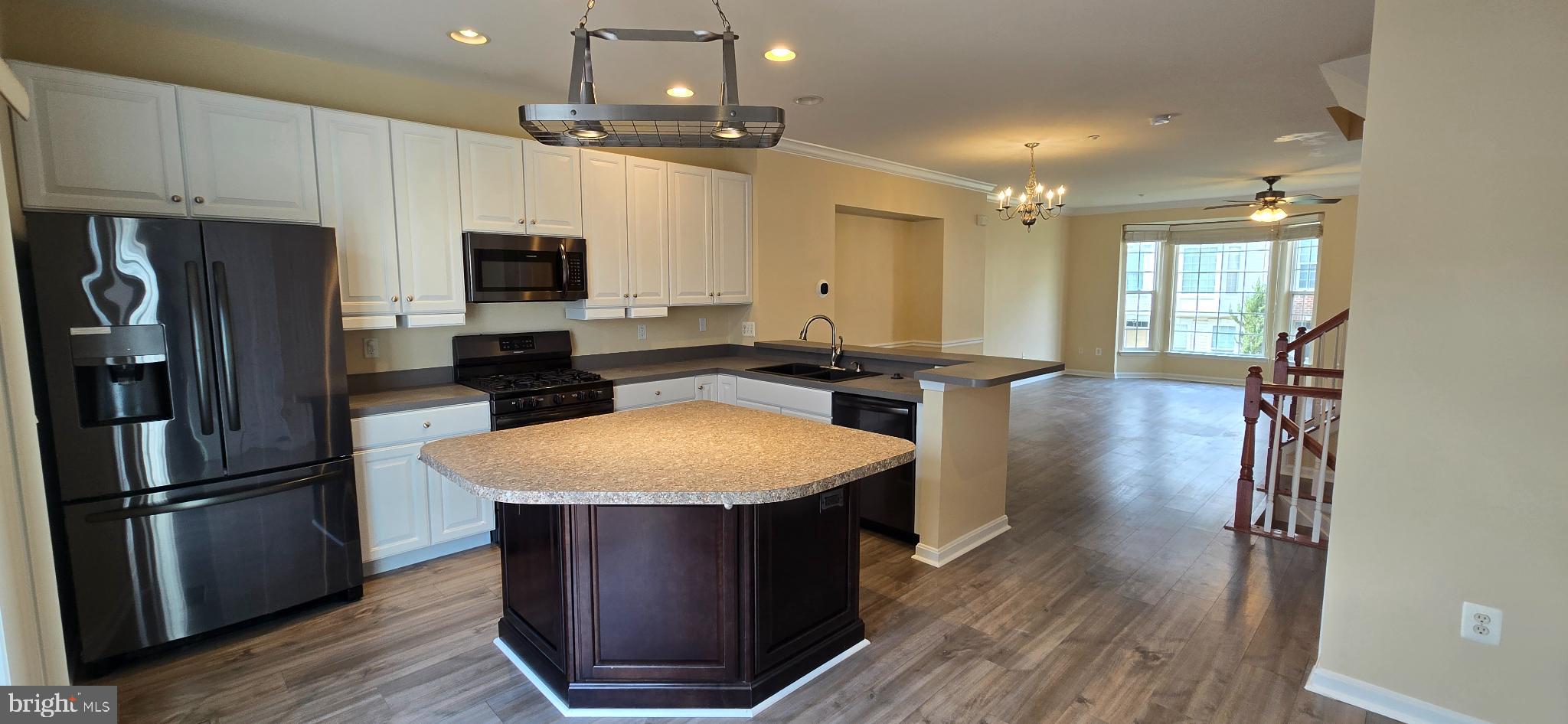 2630 Raptor Drive Odenton, MD 21113 - Photo 8 of 38 a kitchen with stainless steel appliances granite countertop a refrigerator a stove a sink a microwave and island