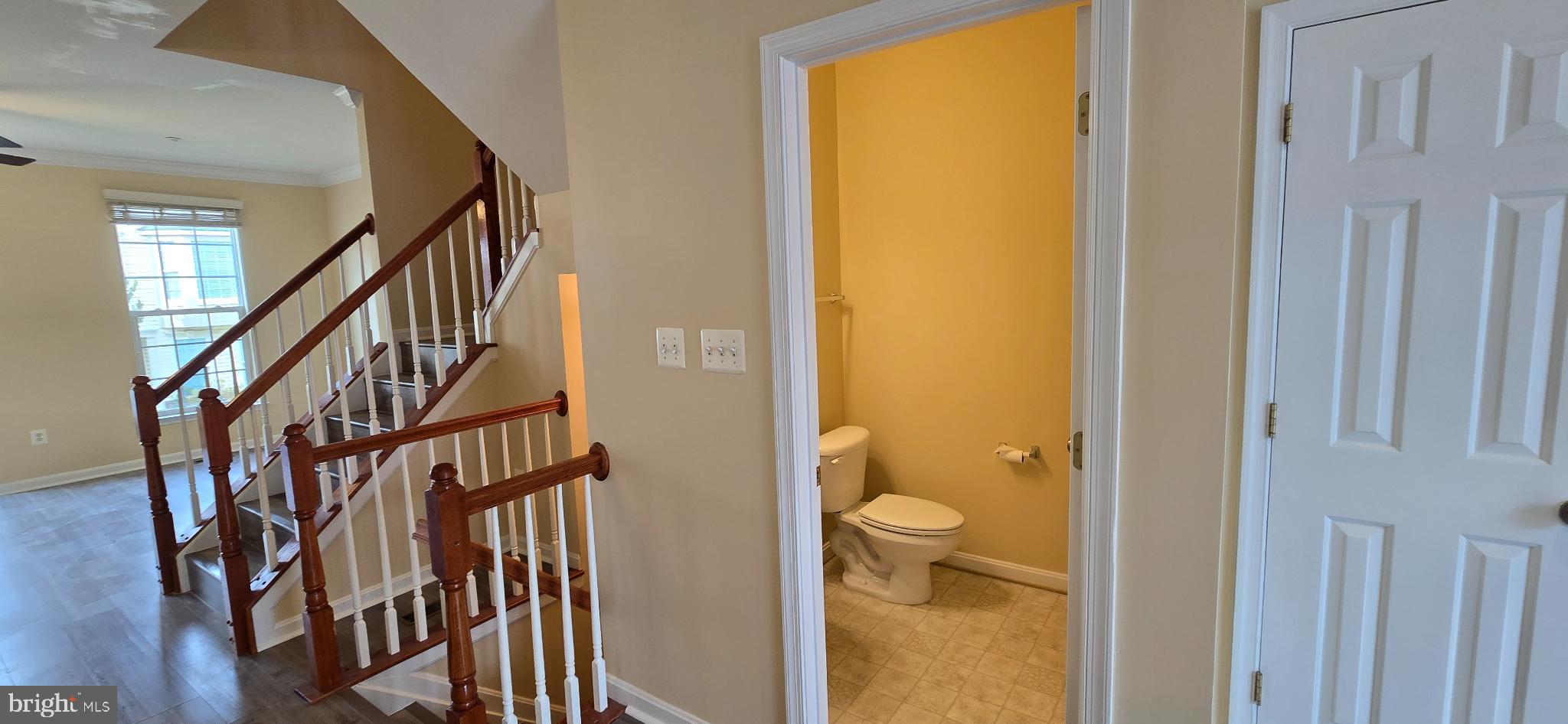 2630 Raptor Drive Odenton, MD 21113 - Photo 9 of 38 a view of staircase with wooden floor and door