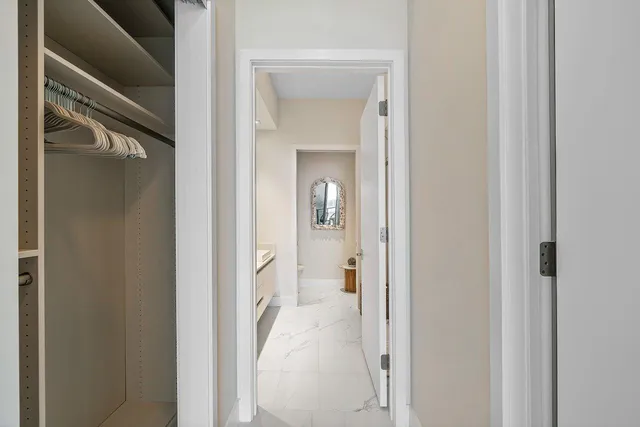 a view of a bathroom from a hallway