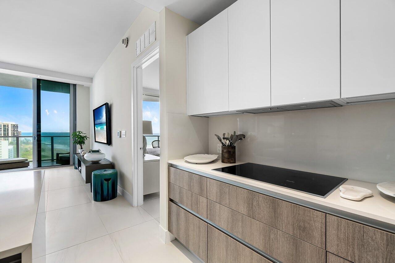 3100 North Ocean Drive, Unit H1602 Singer Island, FL 33404 - Photo 9 of 46 a kitchen with a sink and cabinets