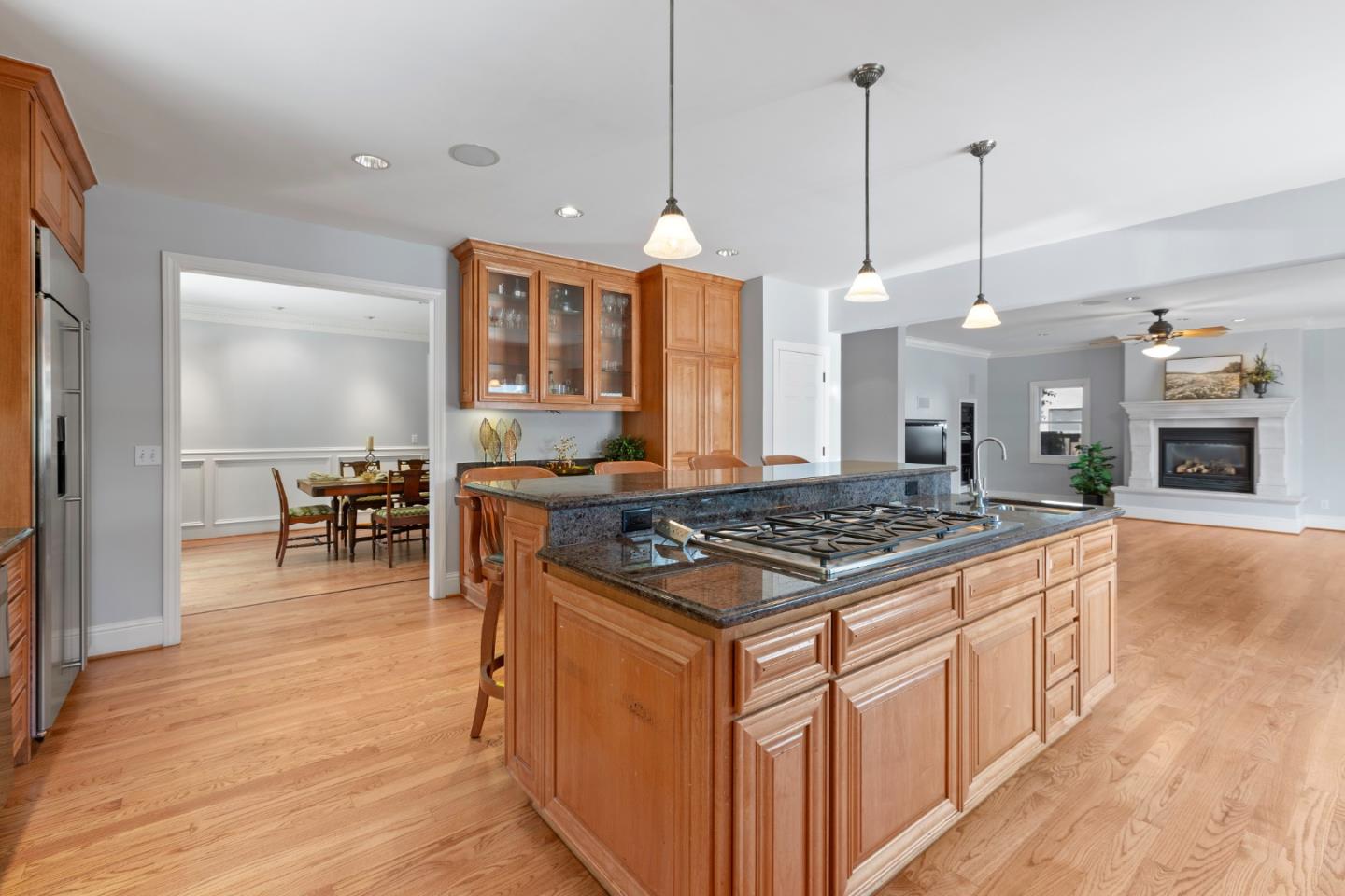 976 Riverside Drive San Jose, CA 95125 - Photo 22 of 78 a kitchen with stainless steel appliances granite countertop a stove a sink and a wooden floor