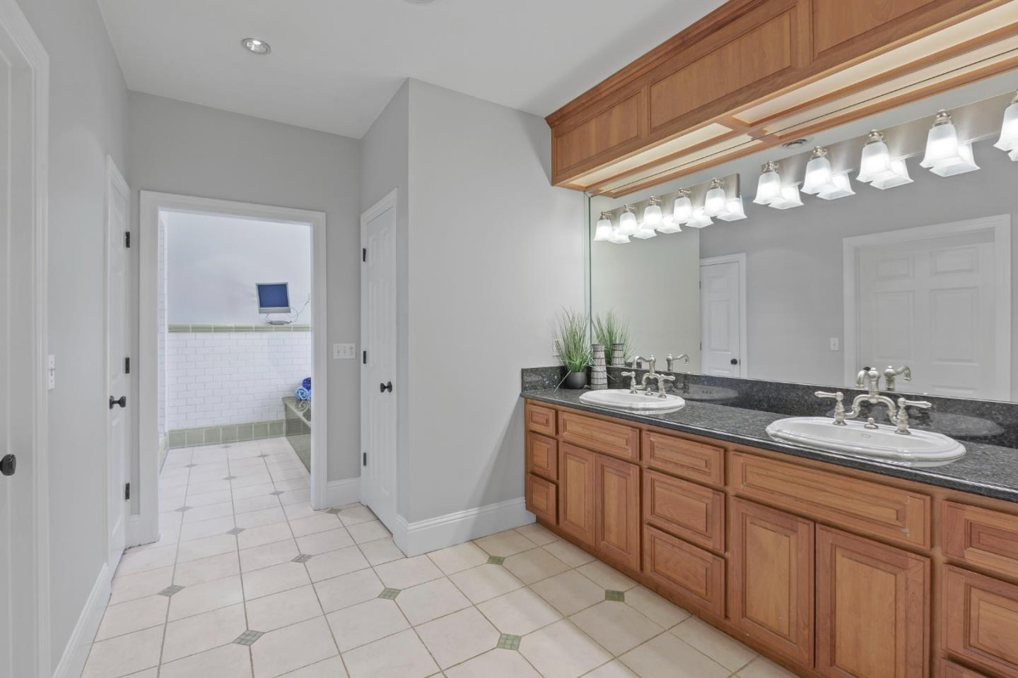 976 Riverside Drive San Jose, CA 95125 - Photo 52 of 78 a spacious bathroom with a mirror a sink and a mirror