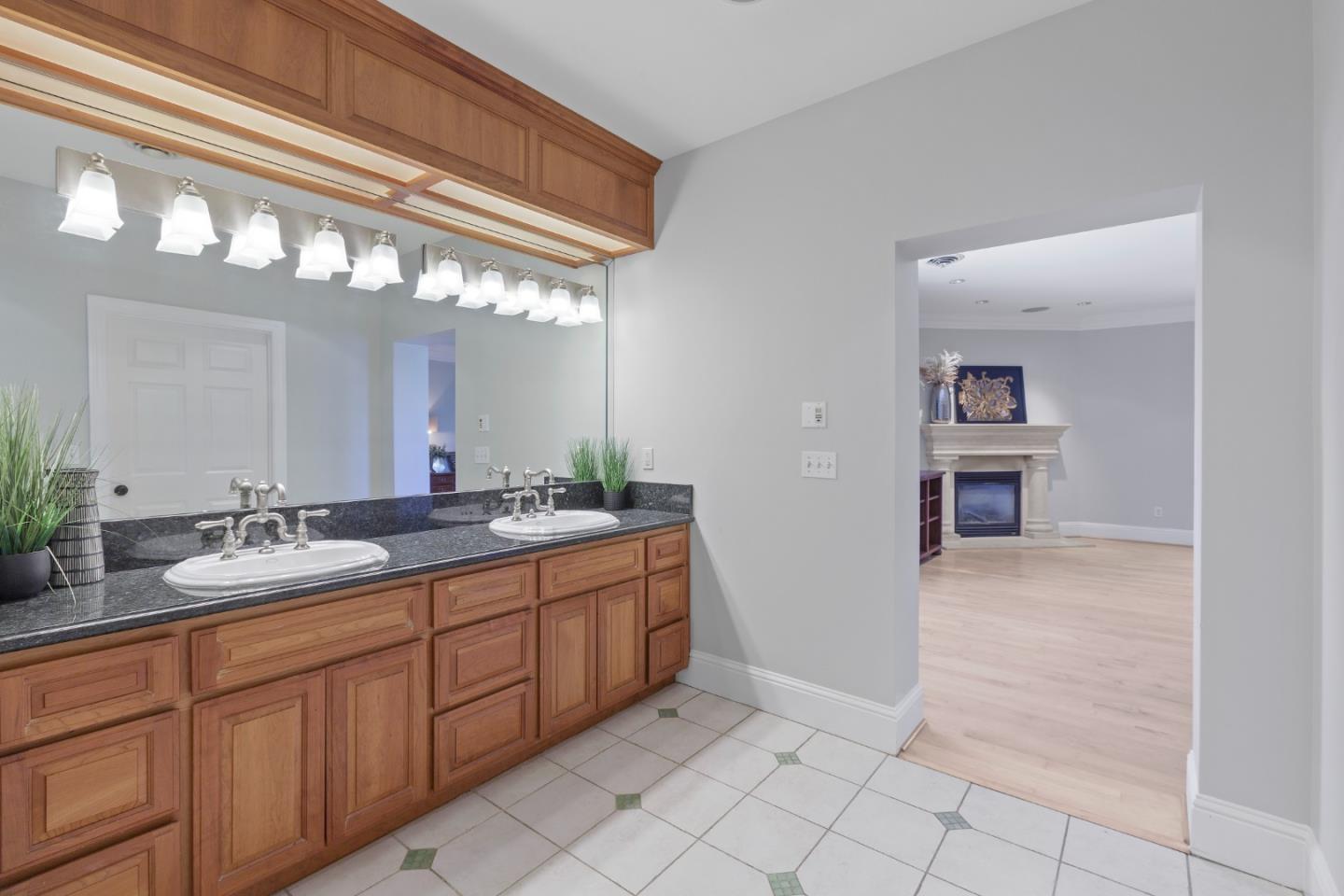 976 Riverside Drive San Jose, CA 95125 - Photo 53 of 78 a bathroom with a double vanity sink and a mirror