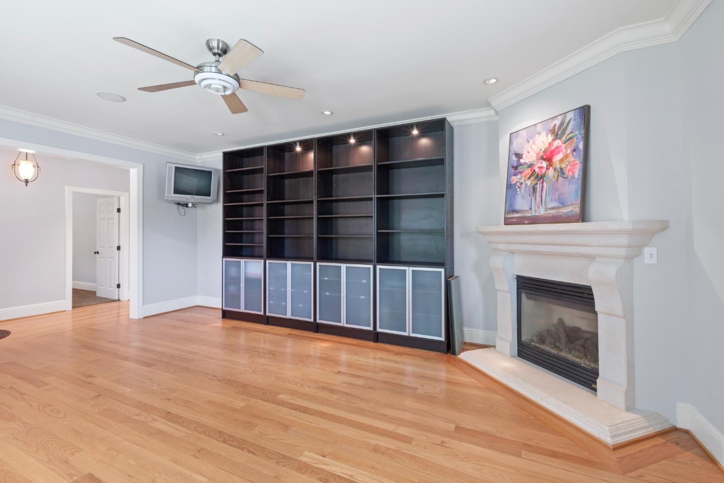 976 Riverside Drive San Jose, CA 95125 - Photo 9 of 78 a view of an empty room with wooden floor fireplace and a window