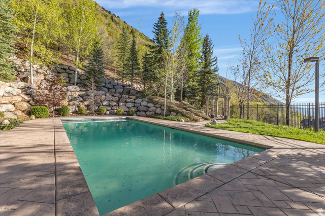 3222 Eagle View Circle Sandy, UT 84092 - Photo 45 of 60 View of pool featuring patio surround