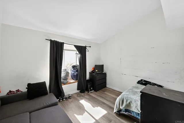 a bed room with a bed and furniture