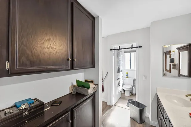 a view of bathroom with a sink mirror vanity and toilet