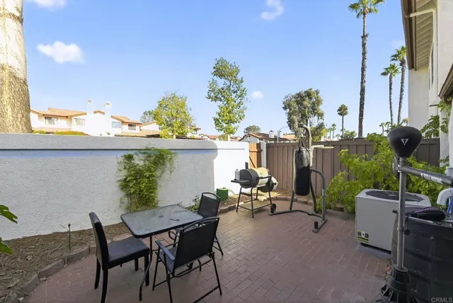 a view of a chairs and table in the patio