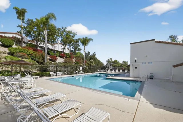 a view of a swimming pool and lounge chair