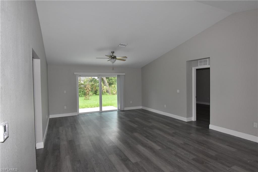 2140 Yalta Terrace North Port, FL 34286 - Photo 26 of 26 Empty room featuring vaulted ceiling, ceiling fan, and dark wood finished floors