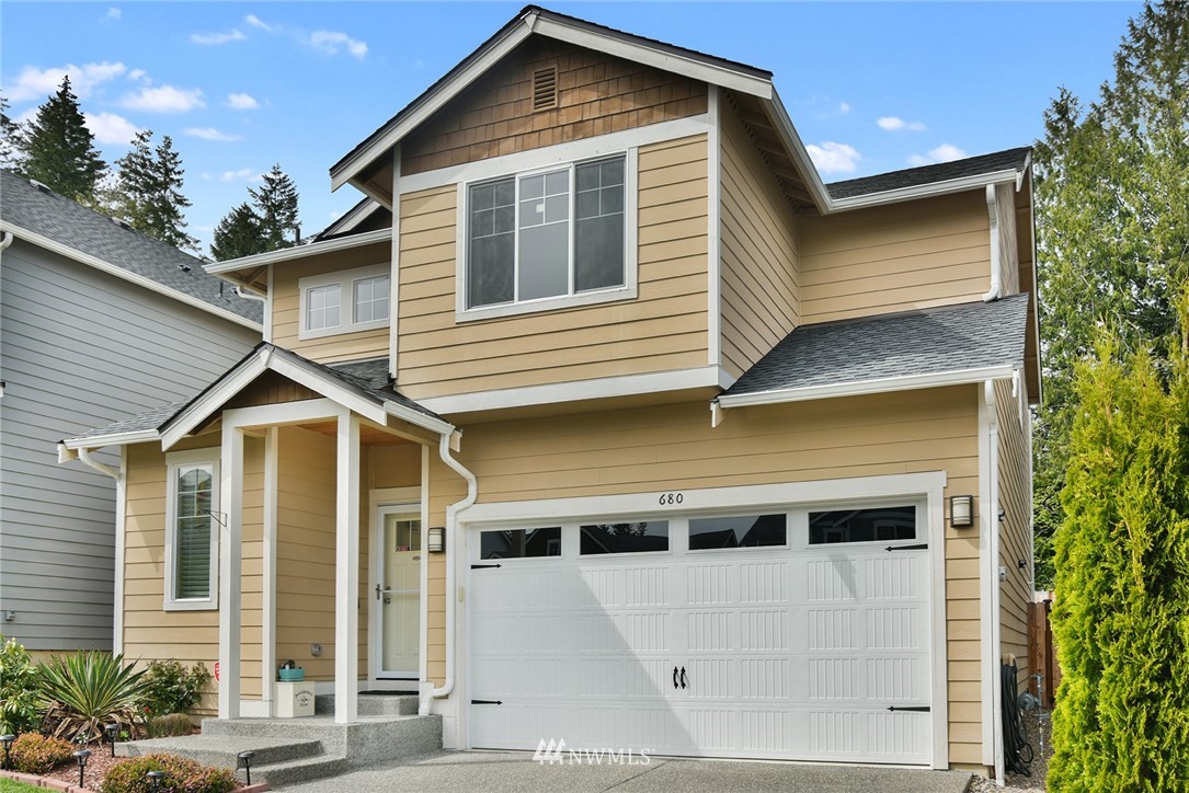 a front view of a house with a yard