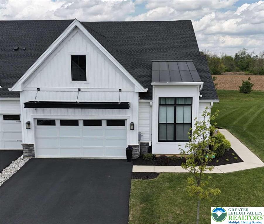 a front view of a house with a yard