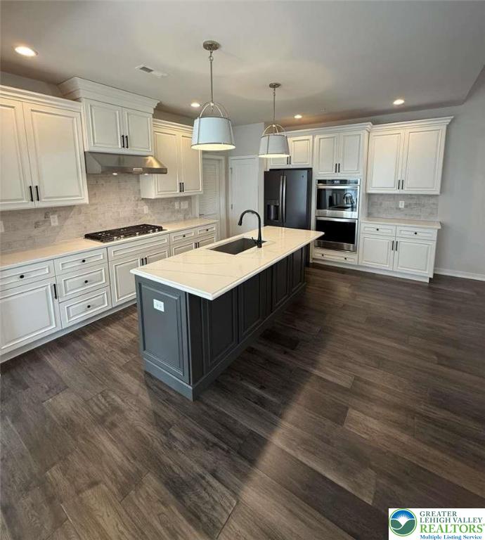 6907 Cedar Drive Bath, PA 18014 - Photo 2 of 23 a large kitchen with stainless steel appliances granite countertop a stove a sink dishwasher and a refrigerator