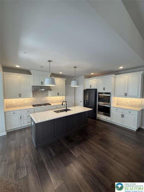 6907 Cedar Drive Bath, PA 18014 - Photo 3 of 23 a large white kitchen with a stove a sink dishwasher and a refrigerator with wooden floor